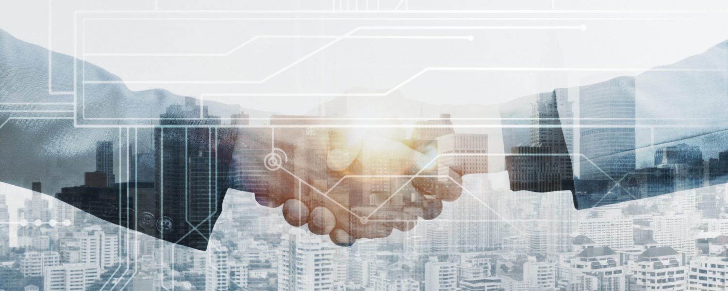 Business partners handshake global corporate with technology concept